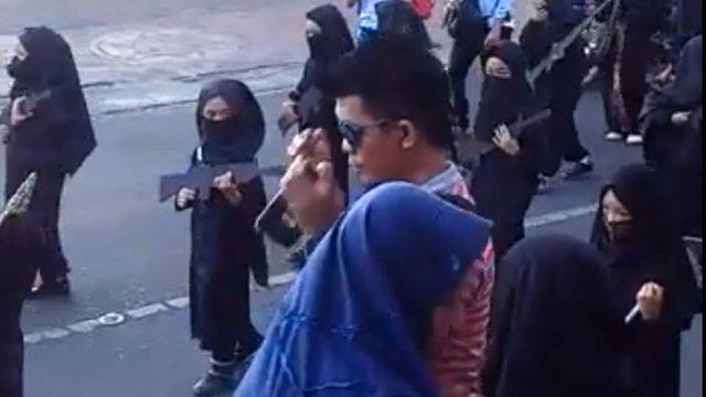 cbsn-fusion-indonesia-parade-featuring-children-dressed-in-black-with-fake-weapons-sparks-outrage-thumbnail-1640290-640x360.jpg 