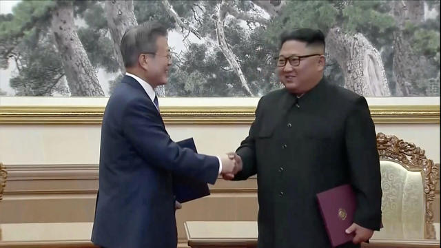 South Korean President Moon Jae-in and North Korean leader Kim Jong Un shake hands after signing documents during the inter-Korean summit at the Paekhwawon State Guesthouse in Pyongyang 
