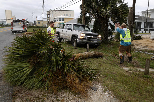 Emergency crews work to clear a street of debris during Hurricane Michael in Panama City Beach 