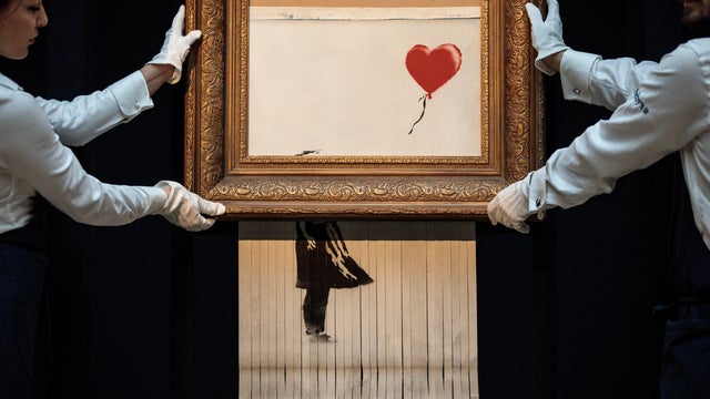 Sotheby's Unveils Banksy's Newly Completed Artwork 'Love in in the Bin' 