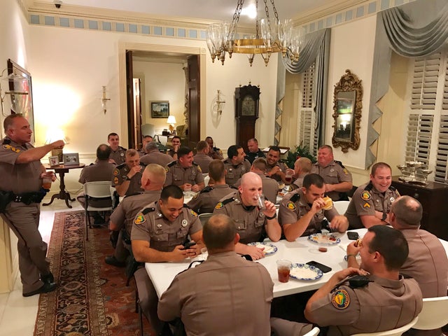 Florida state troopers dine at the governor's mansion in Tallahassee on Oct. 11, 2018.