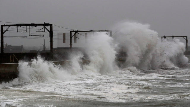 Waves crash against the wall alongside the railway line in Saltcoats as storm Callum hits Scotland 