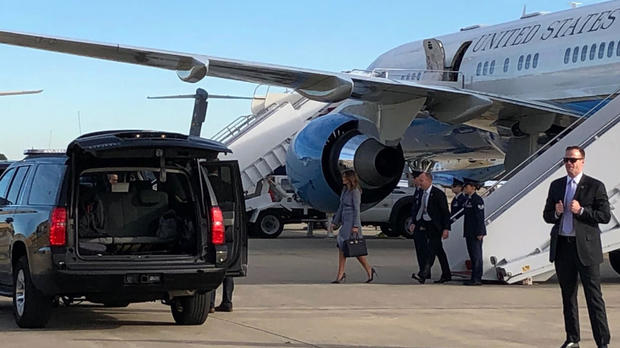 First lady Melania Trump walks on the tarmac at Joint Base Andrews in Maryland after a plane carrying her unexpectedly returned to the military base on Oct. 17, 2018. 