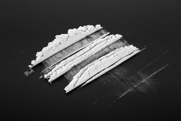 Cocaine powder on a black background 