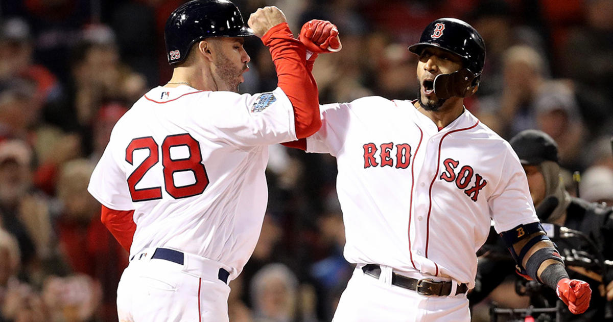 Xander Bogaerts, Rafael Devers, and J.D. Martinez of the Boston Red News  Photo - Getty Images