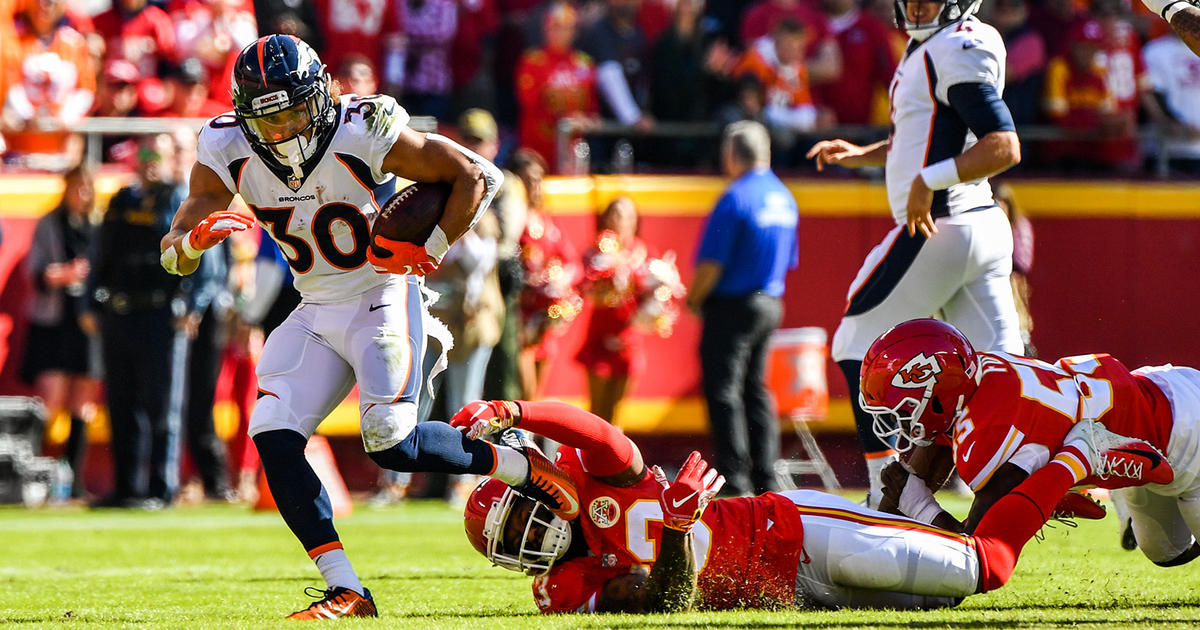 Denver Broncos wide receiver Demaryius Thomas (88) makes a catch in front  of Kansas City Chiefs cornerback Kenneth Acker (25) during the second half  of an NFL football game in Kansas City