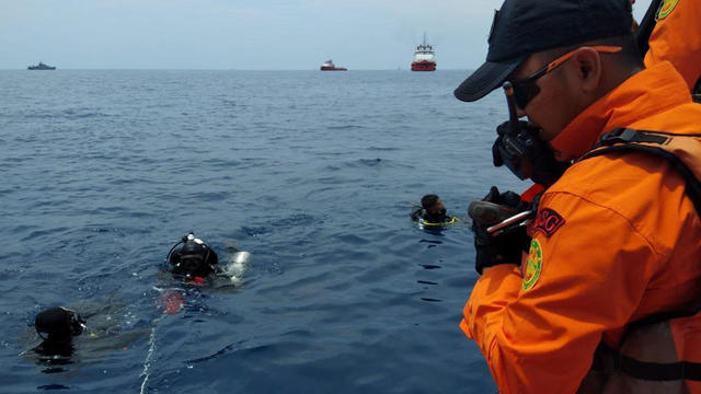 Rescue personnel prepare to dive at the location where a Lion Air plane crashed into the sea in the north coast of Karawang regency 