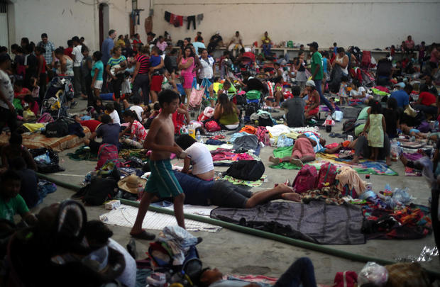 Migrants, part of a caravan of thousands traveling from Central America en route to the United States, rest in a makeshift camp in Santiago Niltepec 