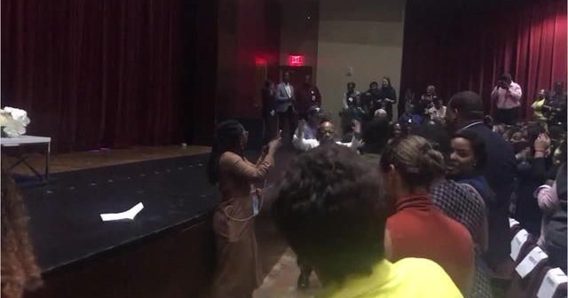 Rep. John Lewis dances to "Happy" at campaign event in CBS News