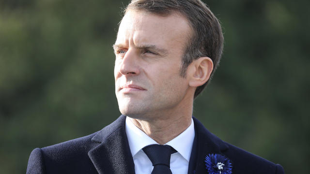 French President Emmanuel Macron looks on from the Point X monument to Les Entonnoirs, in Les Eparges 