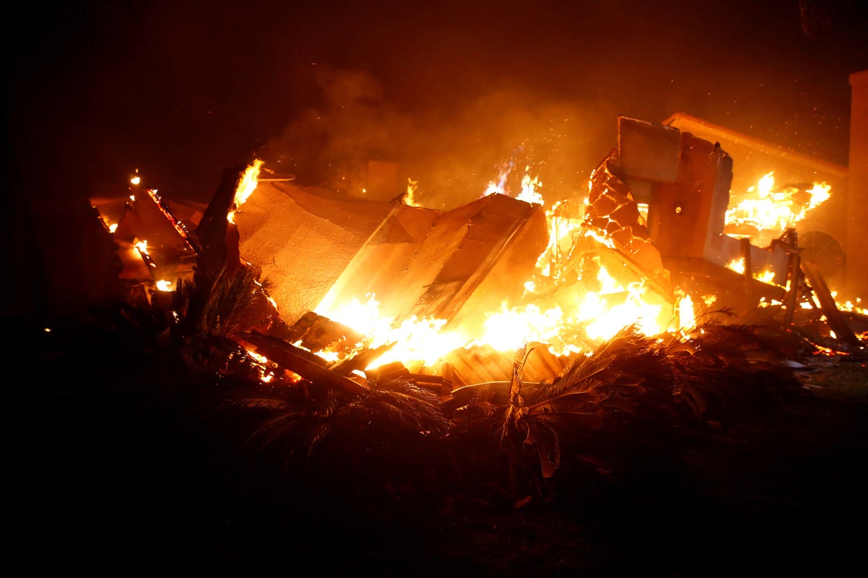 A home burns during a wildfire that claimed dozens of homes in Thousand Oaks 