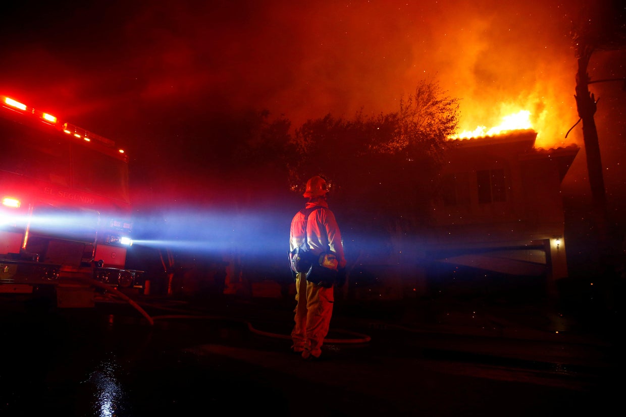 Firefighters battle flames overnight during a wildfire that burned dozens of homes in Thousand Oaks 