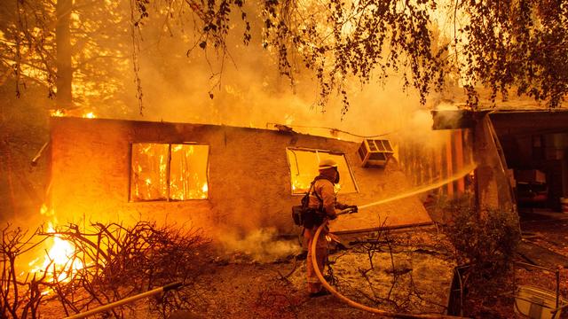 A home burns during a wildfire that claimed dozens of homes in Thousand Oaks 