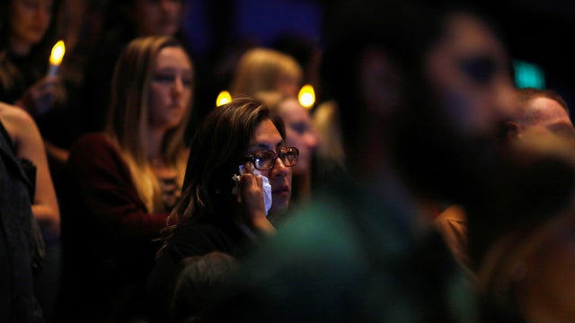 Mourners are seen at a vigil for families of victims of a mass shooting in Thousand Oaks, California 