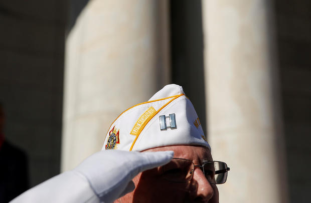 A veteran salutes during ceremonies on Veteran's Day at Arlington National Cemetery in Arlington 