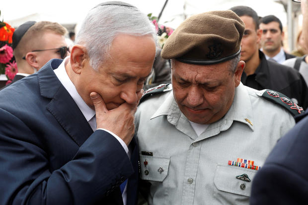 Israeli Prime Minister Benjamin Netanyahu chats with Israeli Chief of Staff Lieutenant-General Gadi Eizenkot as they attend an annual state memorial ceremony for Israel's first prime minister, David Ben Gurion, at his gravesite in Sde Boker 