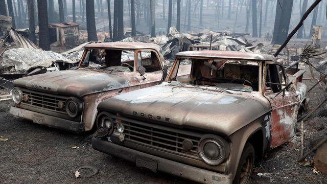 Trucks destroyed by the Camp Fire are seen in Paradise 