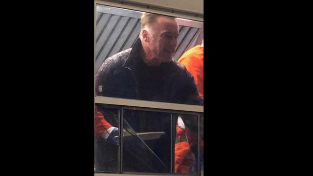 Former California Gov. Arnold Schwarzenegger helps serve breakfast to firefighters battling the Camp Fire in Northern California on Nov. 21, 2018.
