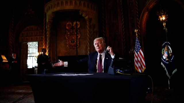 U.S. President Donald Trump speaks via video teleconference with troops from Mar-a-Lago estate in Palm Beach 