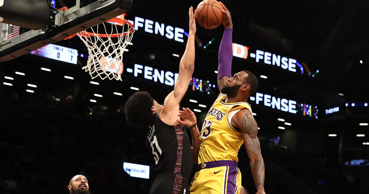 LeBron James of the Los Angeles Lakers dunks against the Brooklyn News  Photo - Getty Images