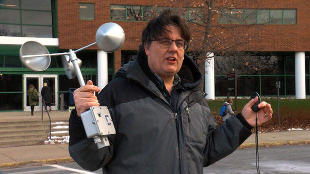 assistant state climatologist pete boulay holds an anemometer to measure wind speed 