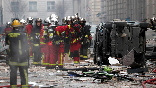 Firemen work at the site of an explosion in a bakery shop in the 9th District in Paris 