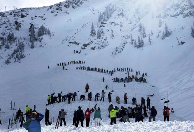 People search for victims after an avalanche buried multiple people near the highest peak of Taos Ski Valley, one of the biggest resorts in New Mexico, Jan. 17, 2019. 