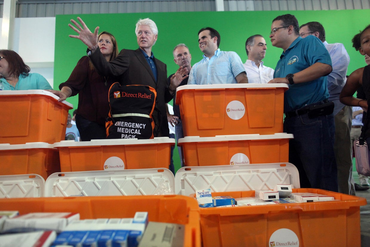 Former U.S. President Clinton and Puerto Rico Governor Rosello visit a school turned shelter for people who have lost their homes during Hurricane Maria in September, in Canovanas 