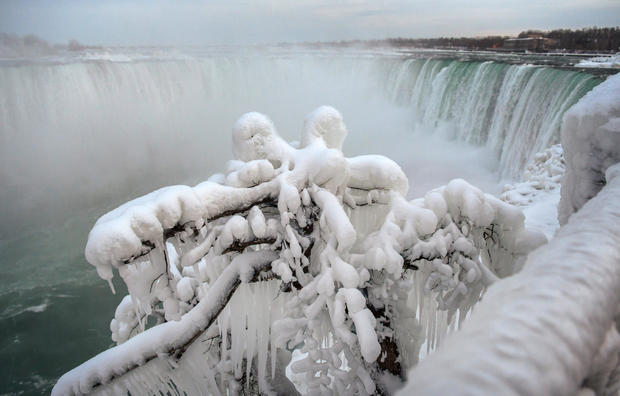 Ice and snow cover branches near the brink of the Horseshoe Falls, due to subzero temperatures in Niagara Falls, Ontario 