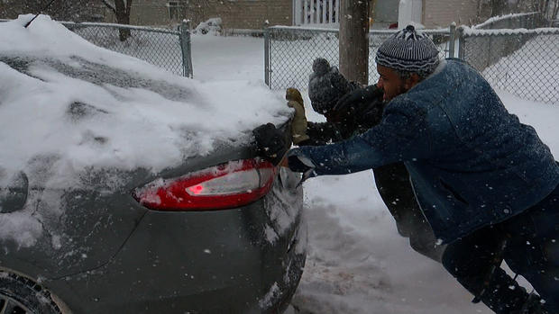 Good Samaritans Push Car During Snow Storm 