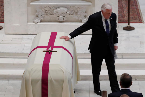 U.S. Rep. Hoyer touches casket during funeral Mass for late U.S. Rep. Dingell at Holy Trinity Church in Washington 