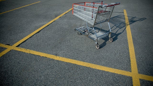 Online shopping and delivery service concept. Paper cartons in a shopping cart on a laptop keyboard, this image implies online shopping that customer order things from retailer sites via the internet. 