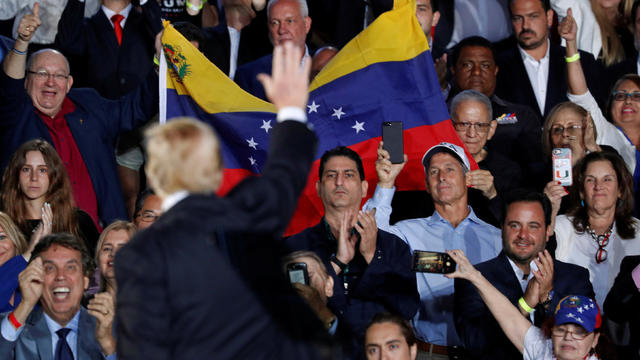 U.S. President Donald Trump waves after speaking about the crisis in Venezuela during a visit to Florida International University in Miami 