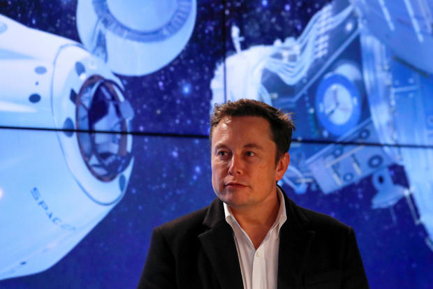 Musk looks on at SpaceX Falcon 9 post-launch news conference in Cape Canaveral 