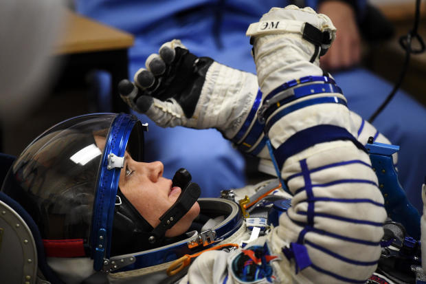 NASA astronaut Anne McClain, a member of International Space Station expedition 58/59, reacts as her spacesuit is tested prior to launch onboard the Soyuz MS-11 spacecraft at the Russian-leased Baikonur cosmodrome in Kazakhstan on Dec. 3, 2018. 