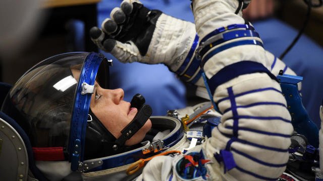 NASA astronaut Anne McClain, a member of International Space Station expedition 58/59, reacts as her spacesuit is tested prior to launch onboard the Soyuz MS-11 spacecraft at the Russian-leased Baikonur cosmodrome in Kazakhstan on Dec. 3, 2018. 