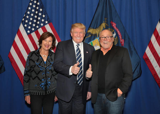 Joan Secchia, and her husband Peter Sechia, former U.S. Ambassador to  Italy,  with President Donald J. Trump at rally held at Deltaplex in Grand Rapids on December 10, 2016 