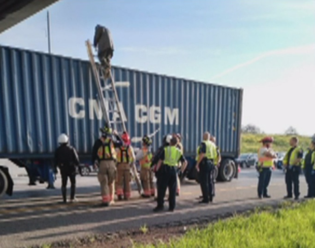 Teen climbs down later on big rig 