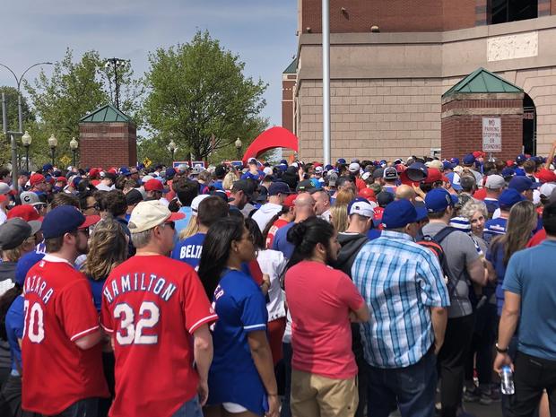Rangers fans wait in line to get into Globe Life Park 