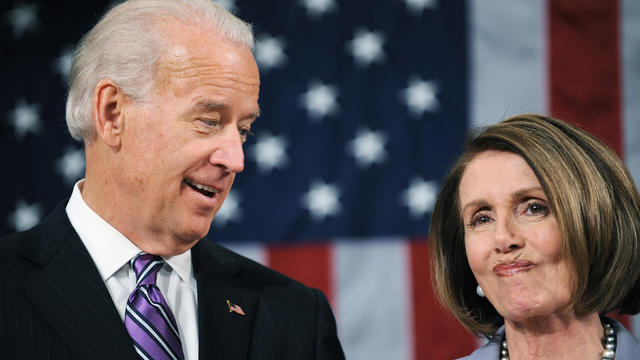 U.S. Vice President Joe Biden and Speaker of the House Nancy Pelosi watch as U.S. President Barack Obama enters the U.S. House chamber in Washington 