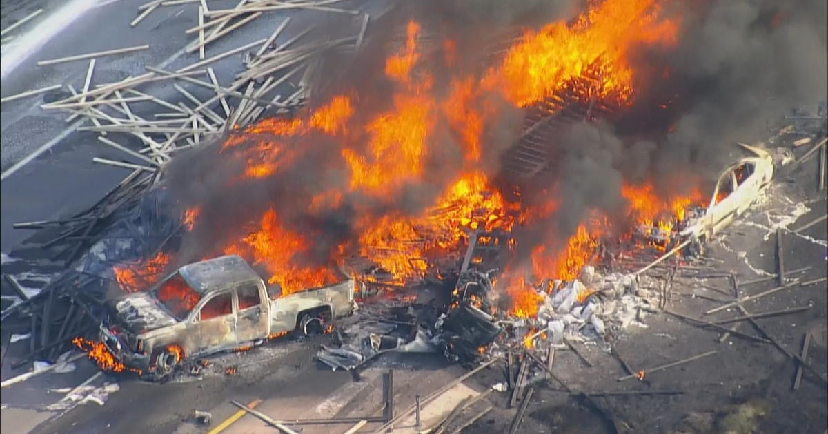 27 vehicles damaged in fiery semi-truck crash at Tooele car