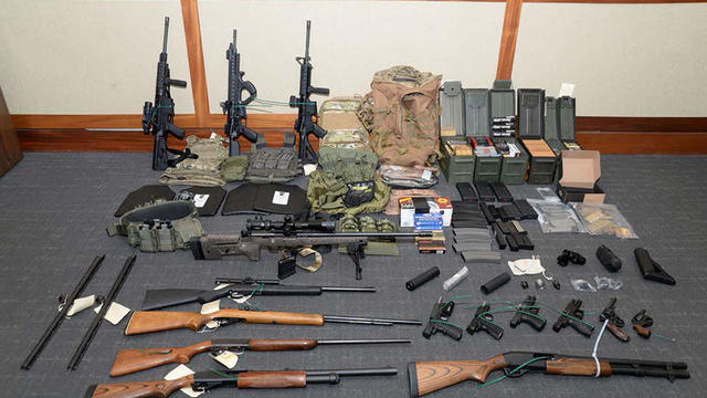 Handout photo of a cache of guns and ammunition uncovered by U.S. federal investigators in the home of U.S. Coast Guard lieutenant Christopher Paul Hasson in Silver Spring, Maryland 