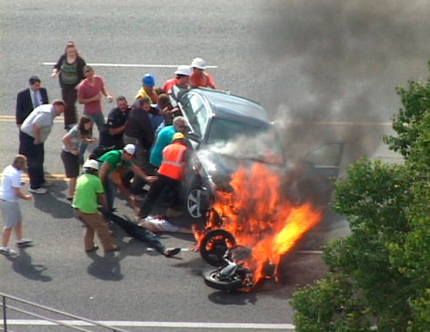 APTOPIX Burning Car Heroes