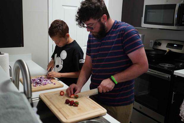 Damien cooks with teacher 