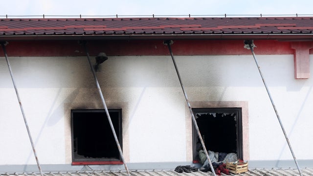 A burned migrant camp is seen in Velika Kladusa 