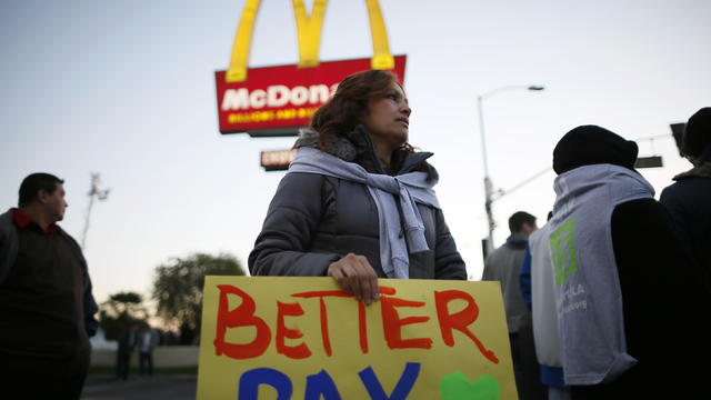 Protesters march outside McDonald's in Los Angeles 