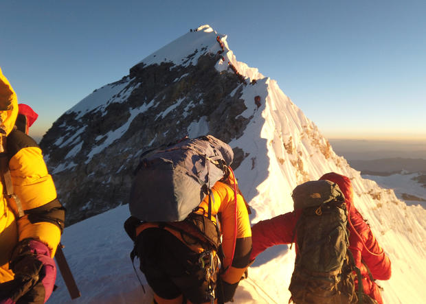 Climbers make their way to the summit of Everest 