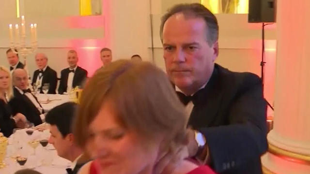 U.K. Foreign Office Minister Mark Field forcibly removes Greenpeace protester Janet Barker during the gala Mansion House dinner in London June 20, 2019, in an image capture taken from video. 