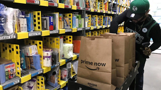 An employee collects items ordered by Amazon.com customers through the company's two-hour delivery service Prime Now in a warehouse in San Francisco 