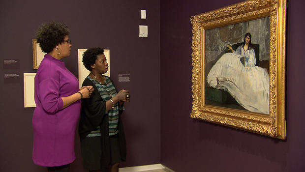 correspondent-nancy-giles-and-curator-denise-murrell-with-manet-painting-jeanne-duval-baudelaires-mistress.jpg 